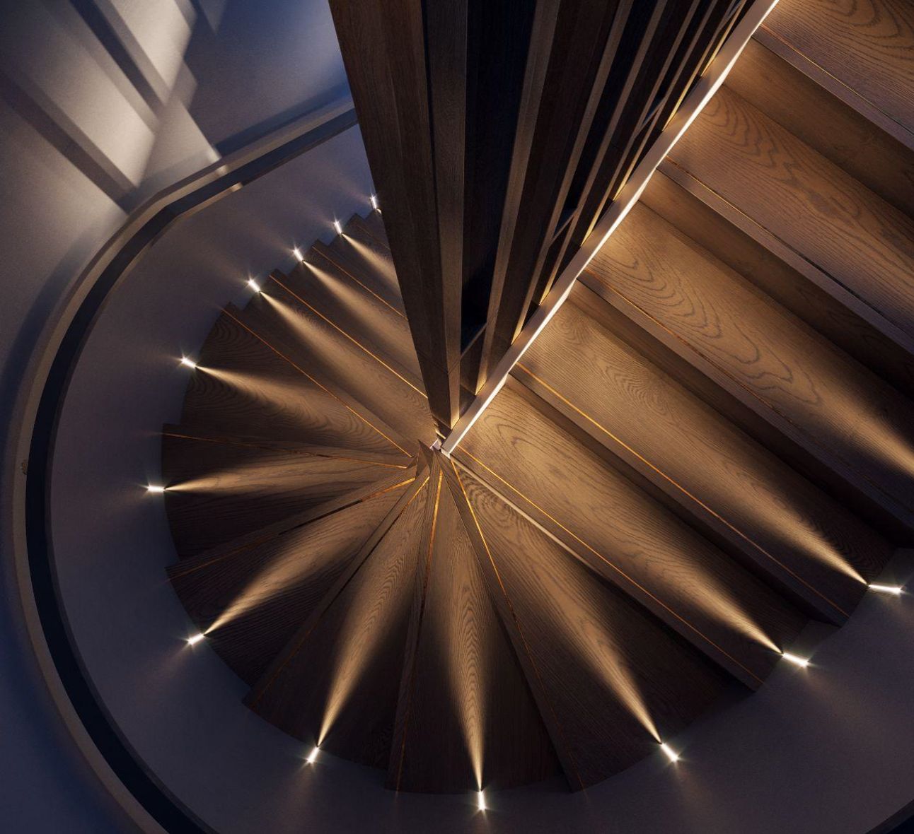 Spiral timber staircase lit by step lights, Luciana